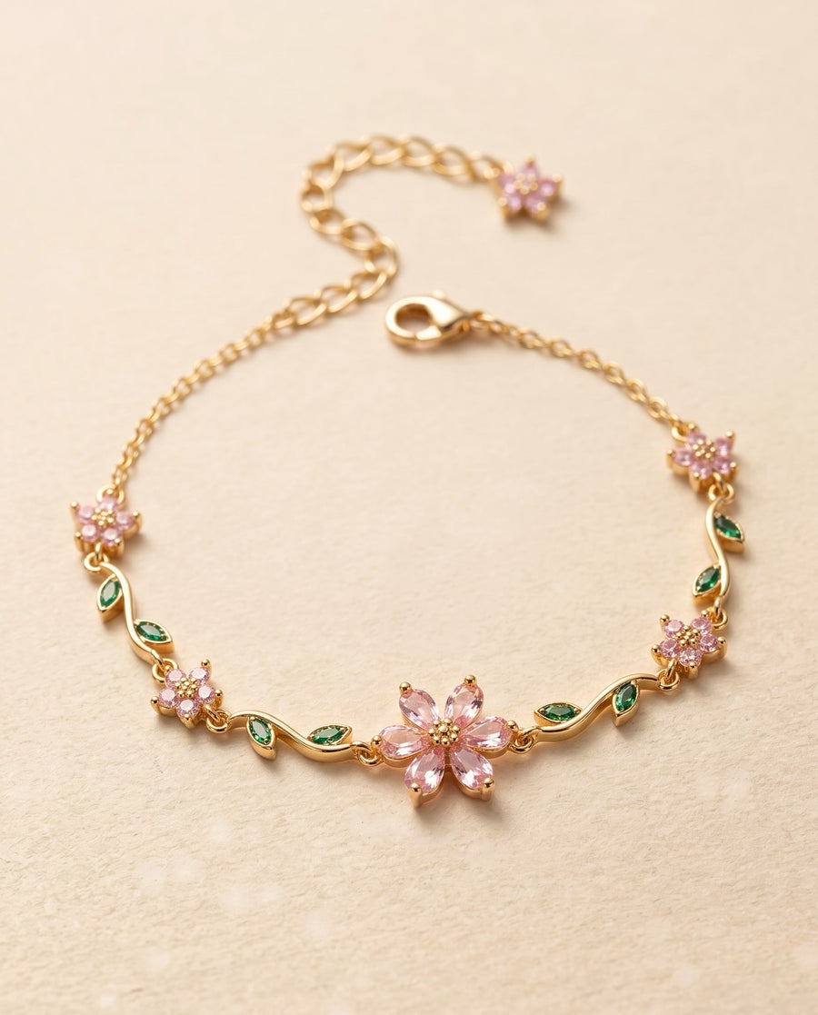 blossom vine bracelet, gold with pink flowers and green leaves