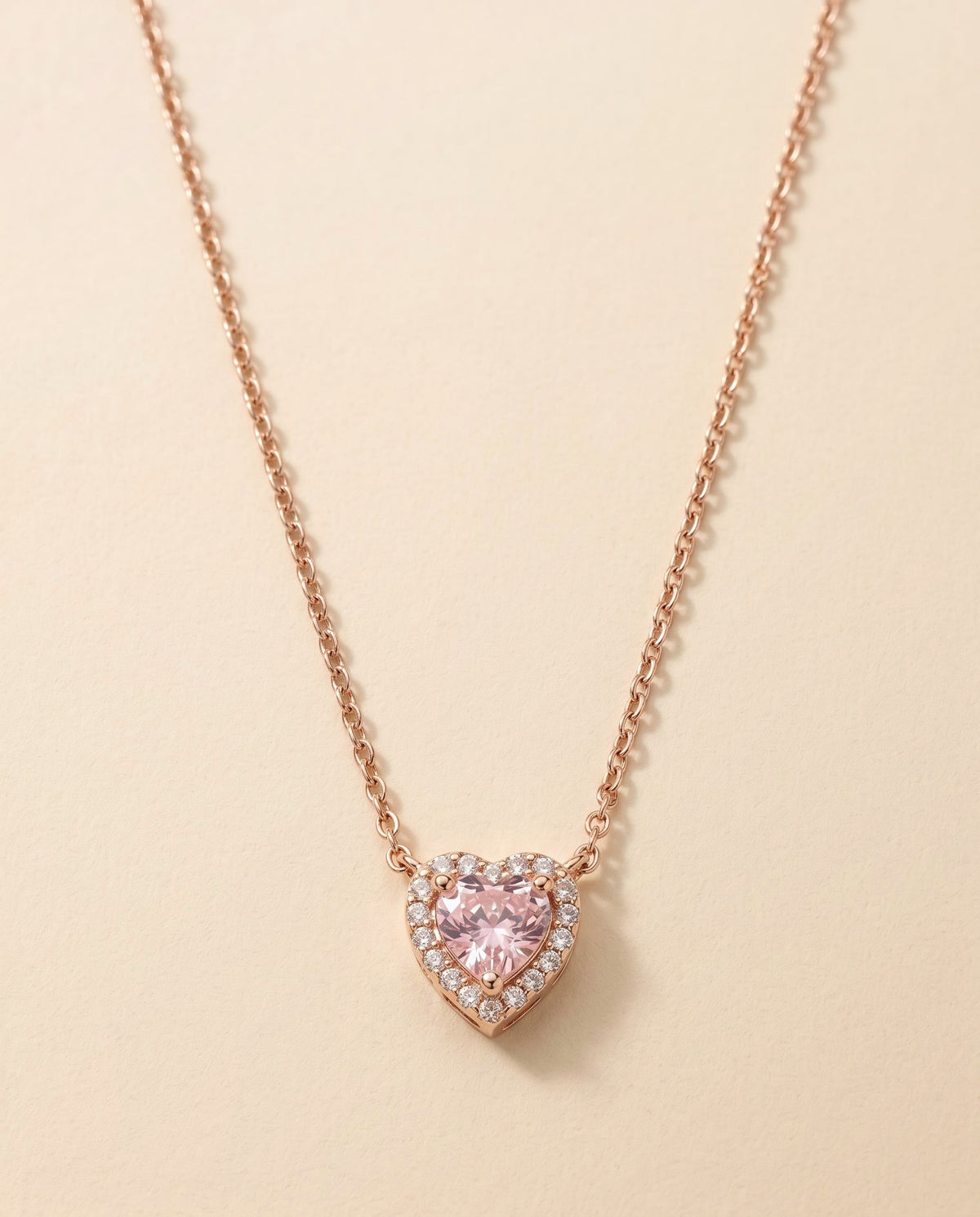 heart locket necklace, pink heart stone in a crystal halo, rose gold