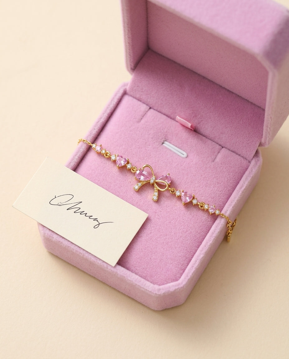little bow bracelet in a pink gift box with a note