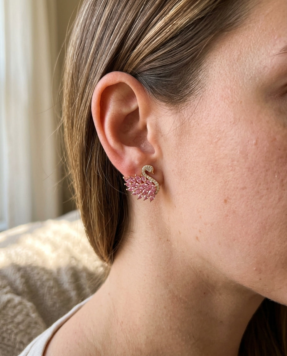 swan earring worn